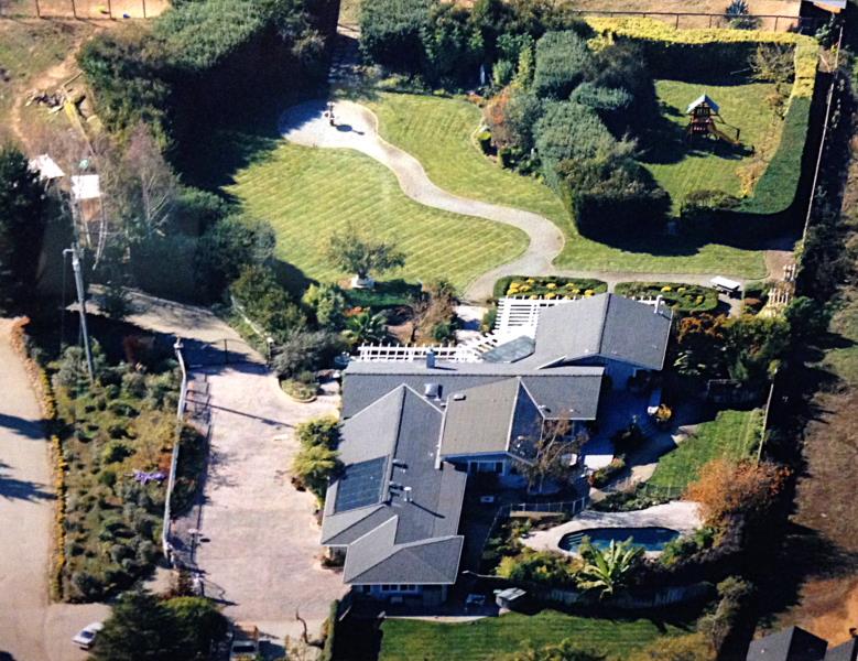 an aerial view of multiple houses with yard