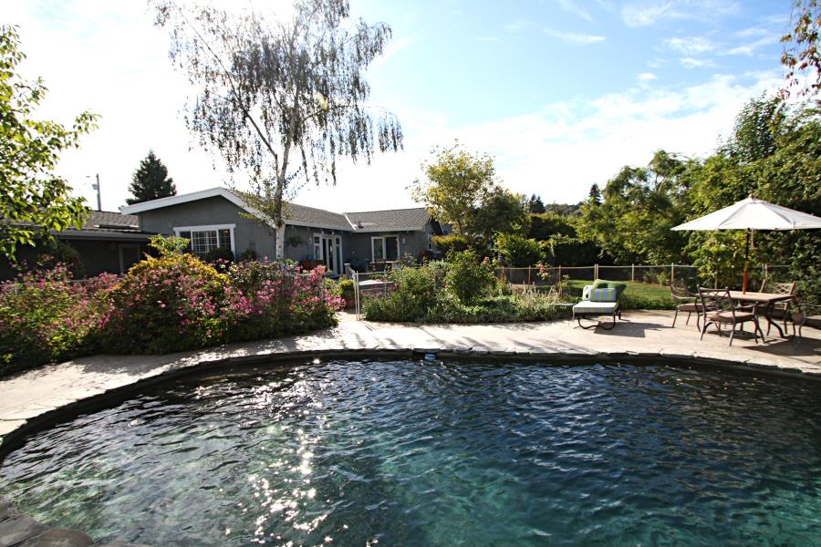 3999 Cherryvale Avenue Soquel, CA 95073 - Photo 13 of 23 a view of patio with table and chairs under an umbrella