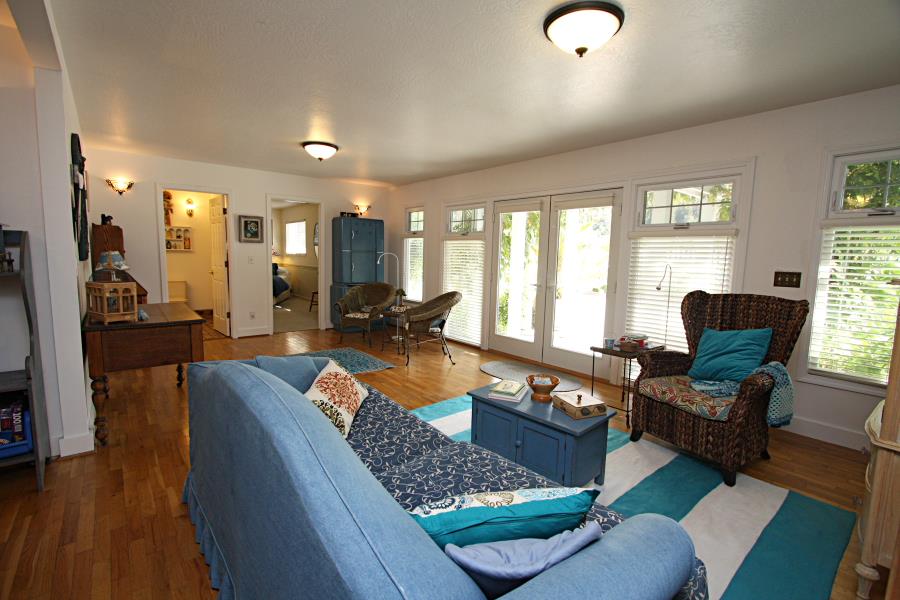 3999 Cherryvale Avenue Soquel, CA 95073 - Photo 16 of 23 a living room with furniture fireplace and wooden floor