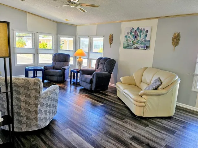 a kitchen with granite countertop a sink stainless steel appliances and cabinets