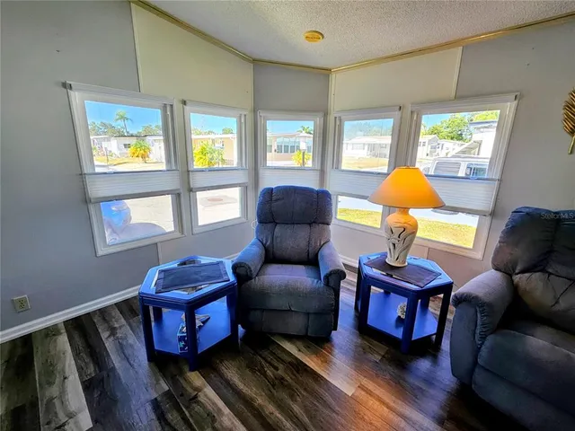 a kitchen with a refrigerator and a sink