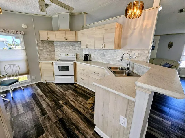 a view of a hallway with a chandelier