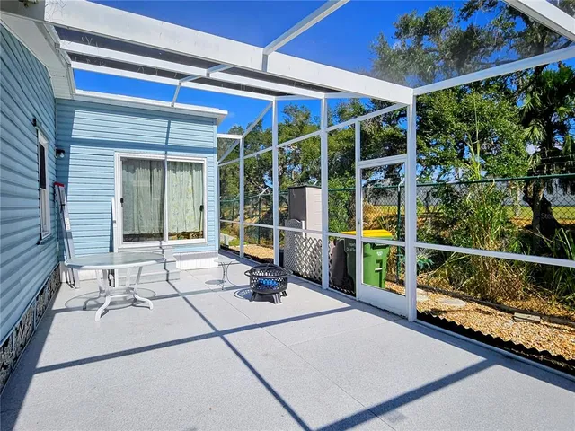 a view of a chairs and table in a patio