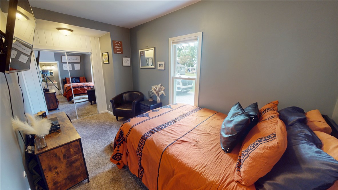 8 Chestnut Street Danville, IL 61832 - Photo 11 of 19 a bedroom with a bed and a mirror