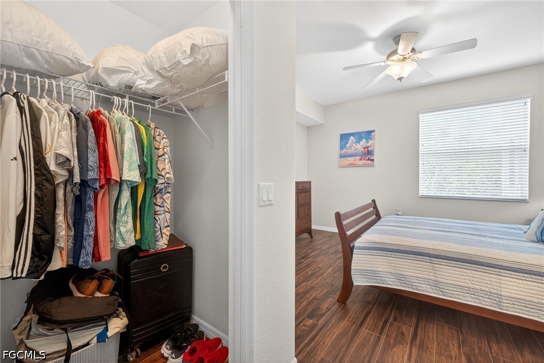 8251 Pathfinder Loop, Unit 621 Fort Myers, FL 33919 - Photo 19 of 30 a view of walk in closet with clothes and shoes