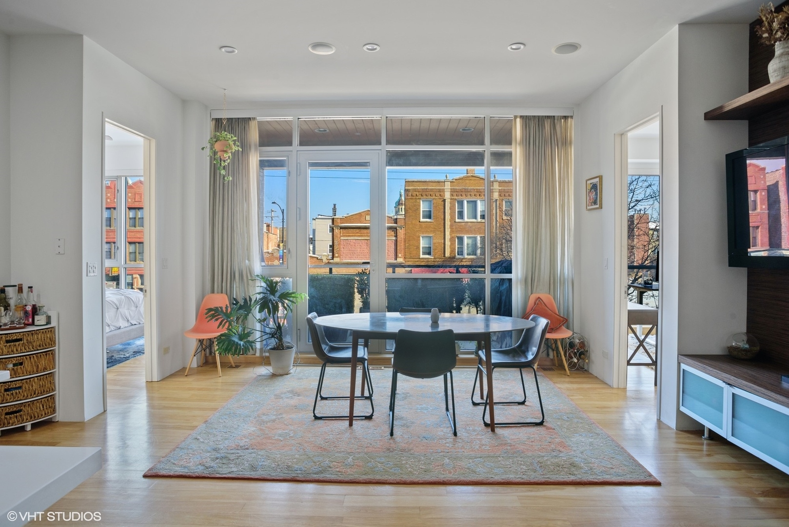 2408 West Rice Street, Unit 203 Chicago, IL 60622 - Photo 5 of 17 a living room with furniture a rug and a bookshelf