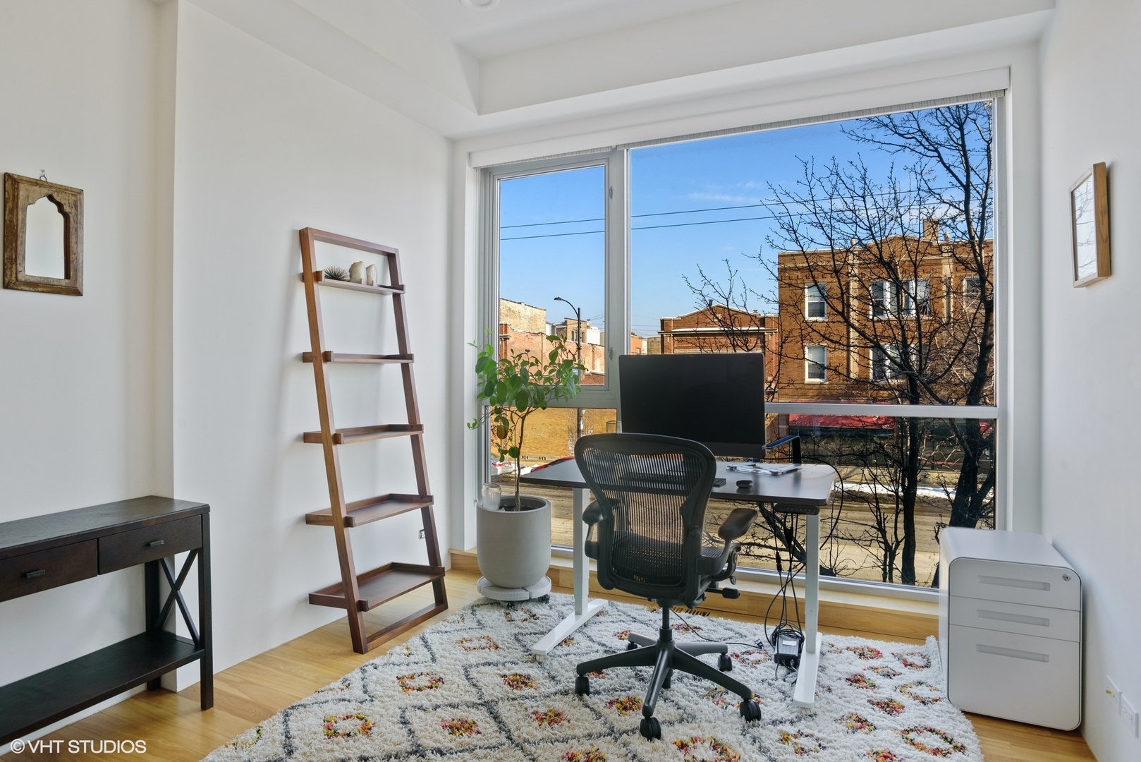 2408 West Rice Street, Unit 203 Chicago, IL 60622 - Photo 6 of 17 a workspace with furniture and rug