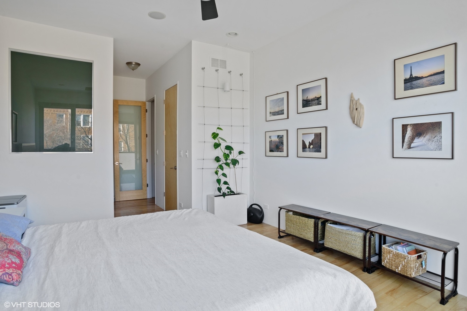 2408 West Rice Street, Unit 203 Chicago, IL 60622 - Photo 9 of 17 a bedroom with a bed and a potted plant