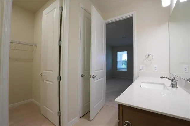 a bathroom with a sink and mirror