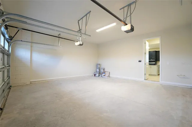 an empty room with a empty space and windows