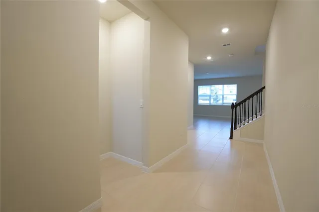a view of hallway with wooden floor