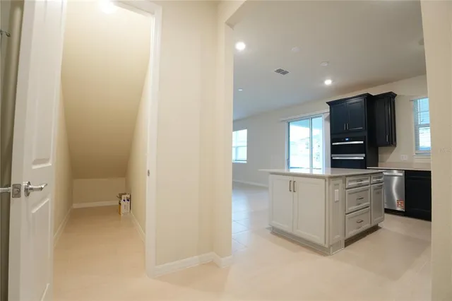 a kitchen with stainless steel appliances a refrigerator and a stove