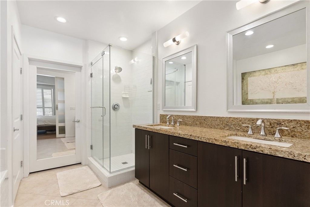 21 Gramercy, Unit 102 Irvine, CA 92612 - Photo 17 of 30 Beautifully appointed primary bath with oversized vanity and elegant finishes throughout.