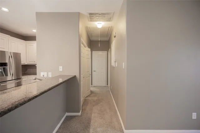 a bathroom with a double vanity sink and mirror