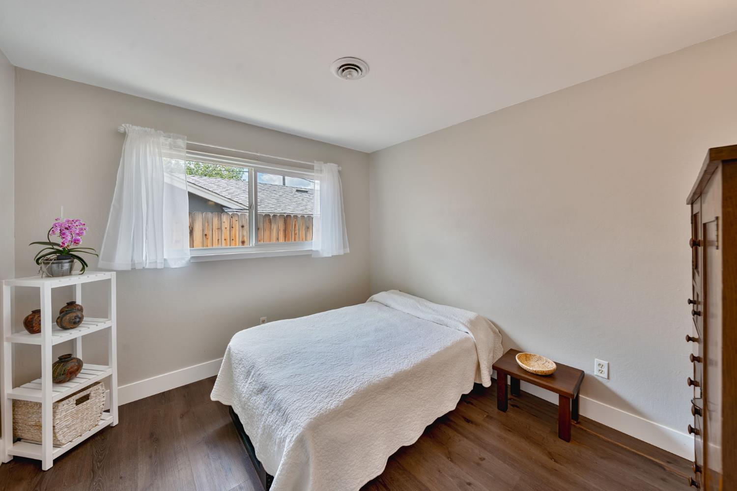 5422 Earnell Street Carmichael, CA 95608 - Photo 27 of 39 a bedroom with a bed and a window