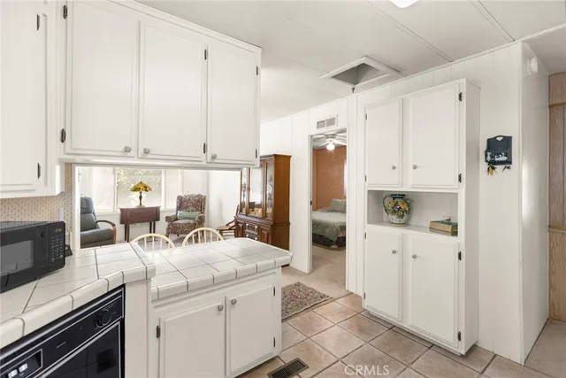 a kitchen with a sink and refrigerator