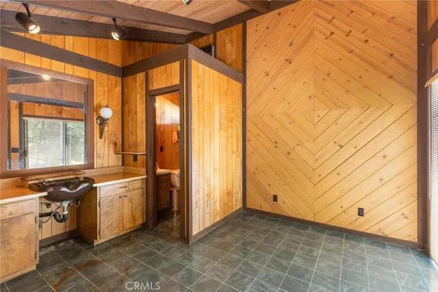 a view of a kitchen with stainless steel appliances granite countertop a stove and a window