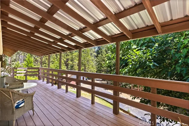 a view of a wooden deck with furniture