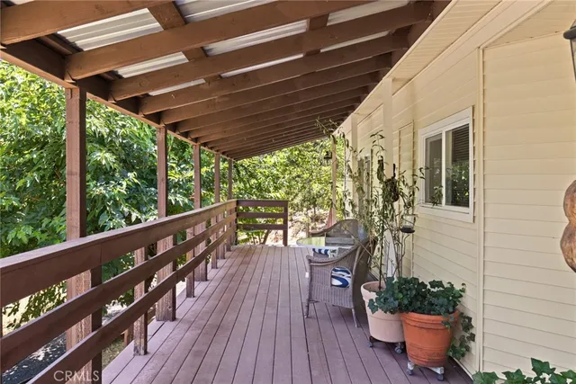 a view of a balcony with wooden floor