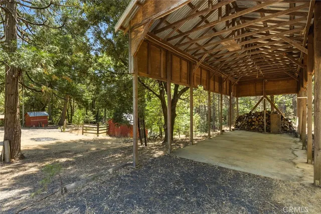 a view of large trees with a room