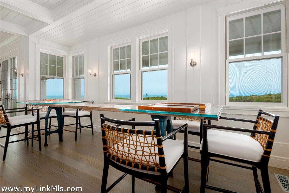 37 Sankaty Head Road Nantucket, MA 02554 - Photo 24 of 65 a view of a dining room with furniture and wooden floor