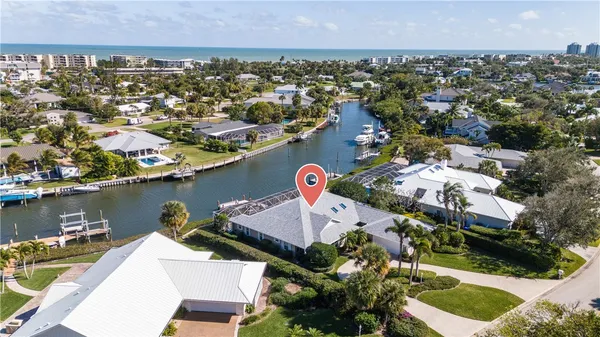 an aerial view of a house with a lake view