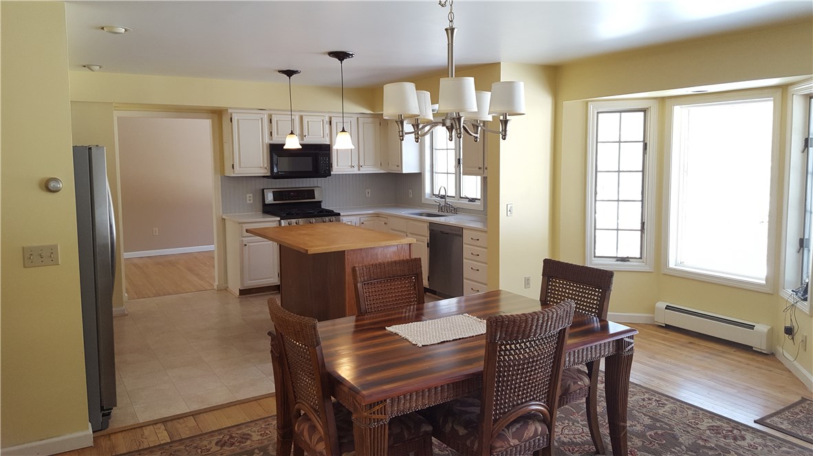 1261 Shannock Road Charlestown, RI 02813 - Photo 3 of 27 Silestone counters ceramic tile floor with hardwoods in Dining area, Gas oven range