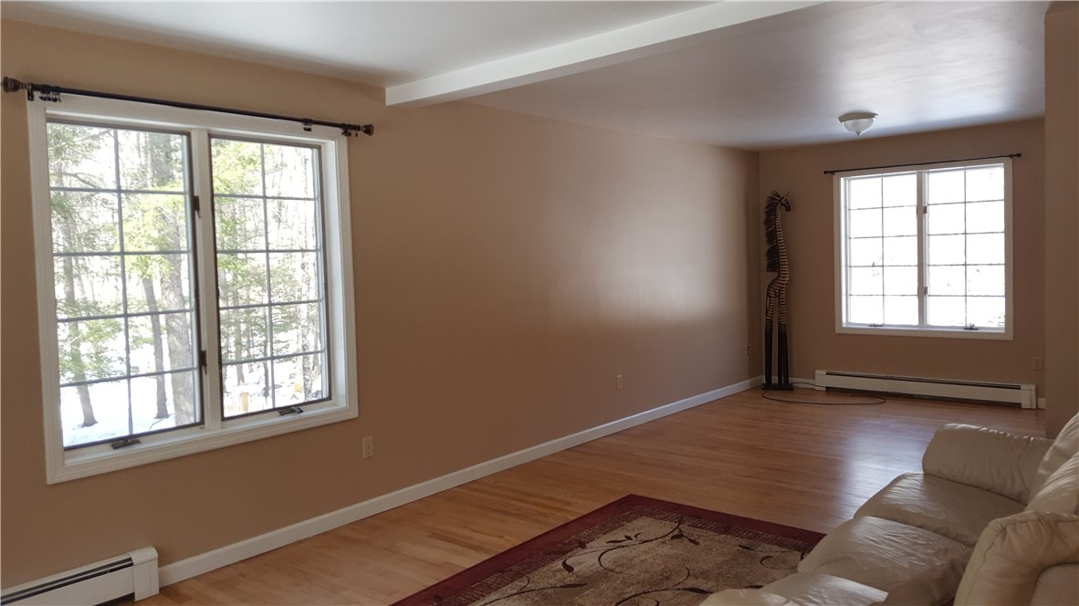 1261 Shannock Road Charlestown, RI 02813 - Photo 6 of 27 front to back living room with hardwood floors