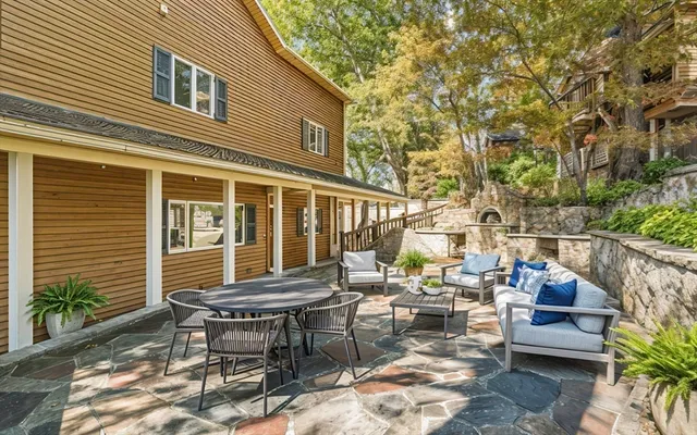a kitchen with stainless steel appliances granite countertop a sink and cabinets