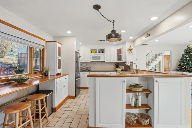 a workspace with furniture and a window