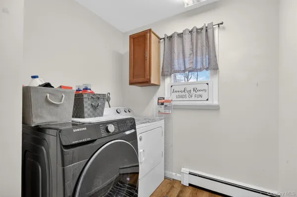 a utility room with dryer and washer