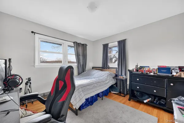 a bedroom with bed and a window