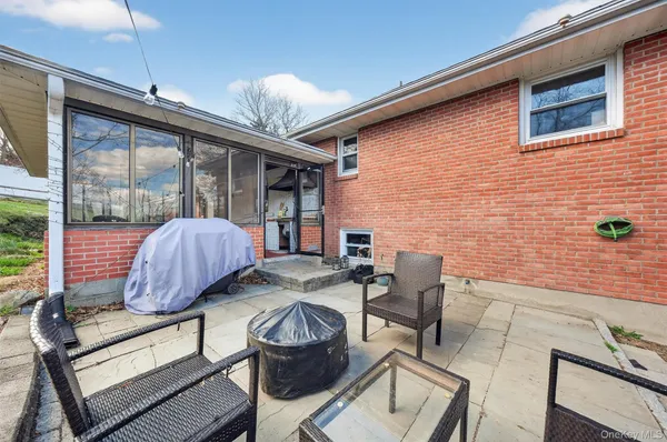 a view of backyard with outdoor seating