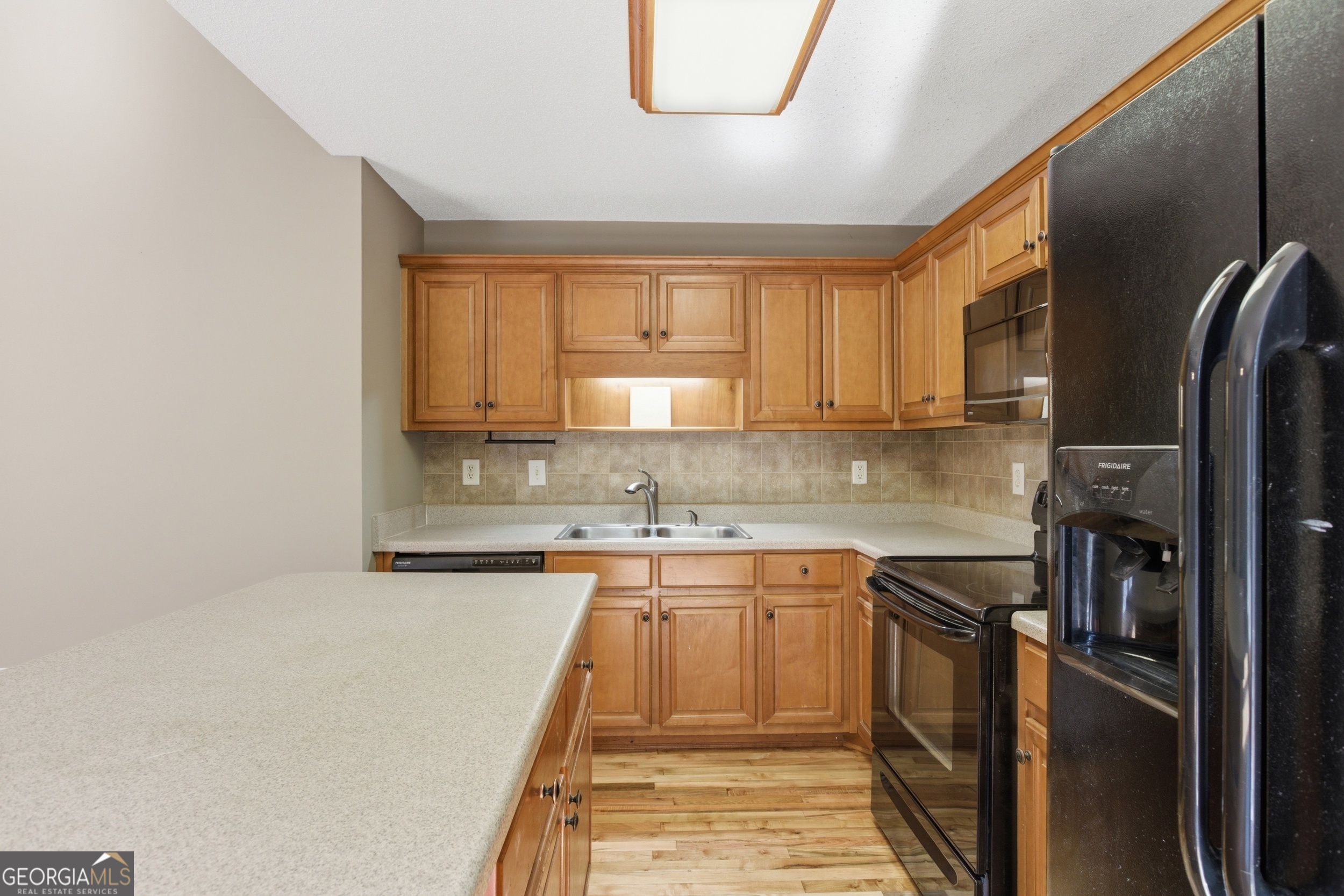 171 Winding Way Hartwell, GA 30643 - Photo 15 of 37 a kitchen with stainless steel appliances granite countertop a sink stove and refrigerator