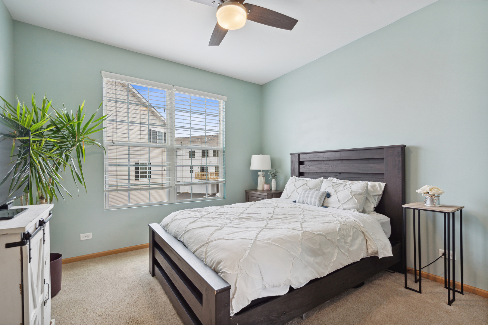 3752 Bailey Road, Unit 3752 Yorkville, IL 60560 - Photo 11 of 20 a bedroom with a large bed and a potted plant