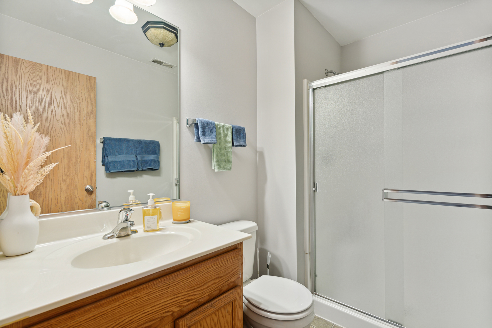 3752 Bailey Road, Unit 3752 Yorkville, IL 60560 - Photo 13 of 20 a bathroom with a sink a toilet a mirror and shower