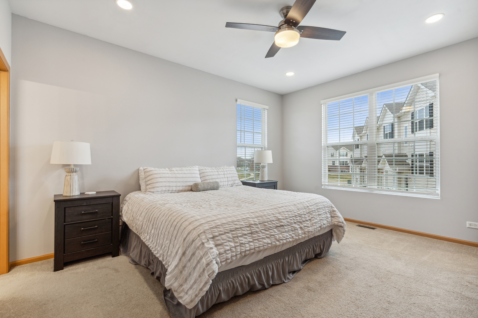3752 Bailey Road, Unit 3752 Yorkville, IL 60560 - Photo 10 of 20 a bedroom with a large bed chandelier and a window