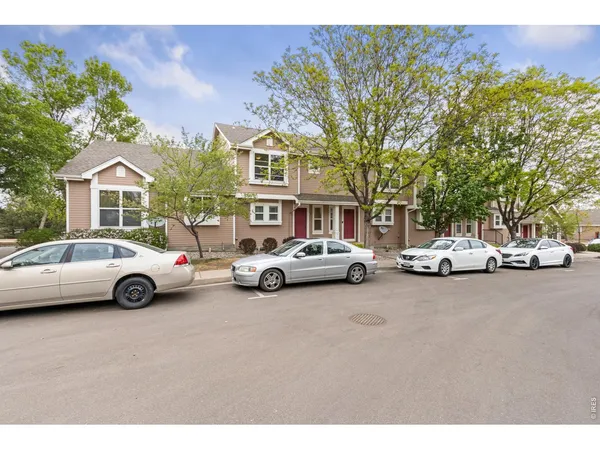 a view of a cars parked in front of a house