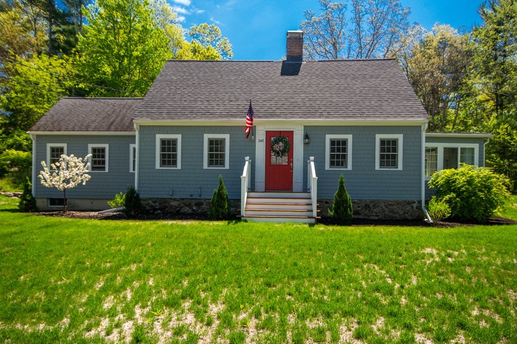 front view of a house with a yard