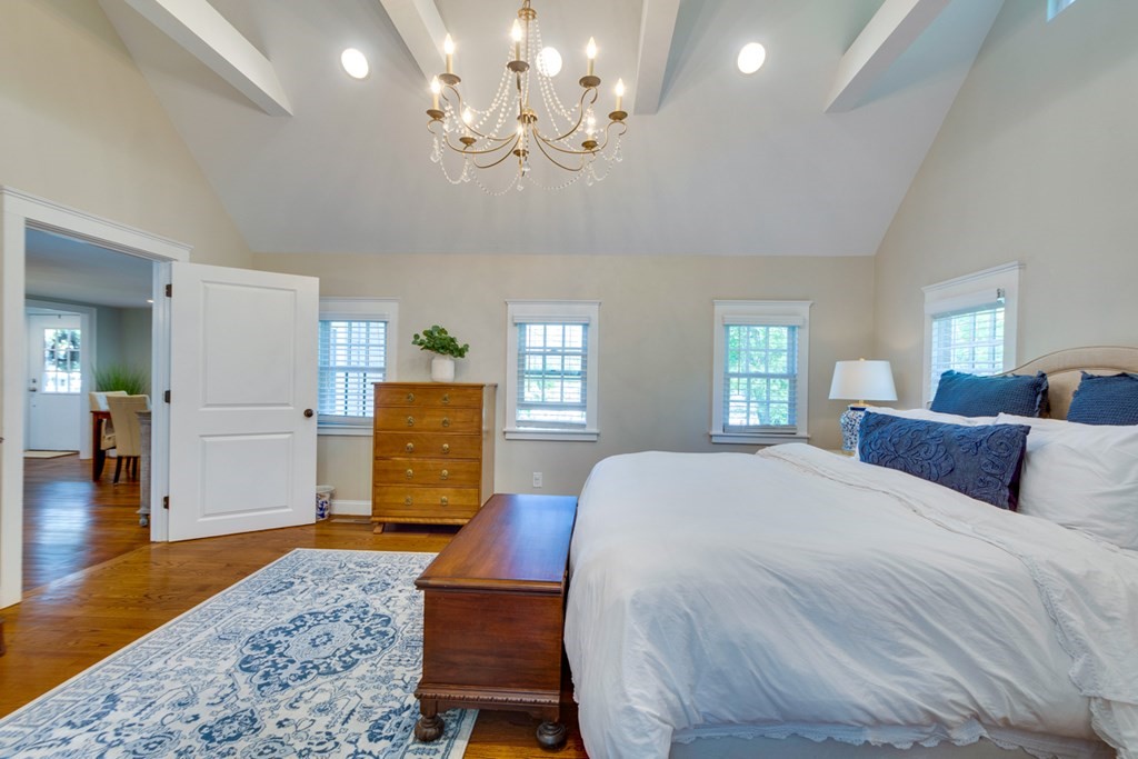 240 Summer Street Walpole, MA 02071 - Photo 17 of 34 a bedroom with a bed and wooden floor