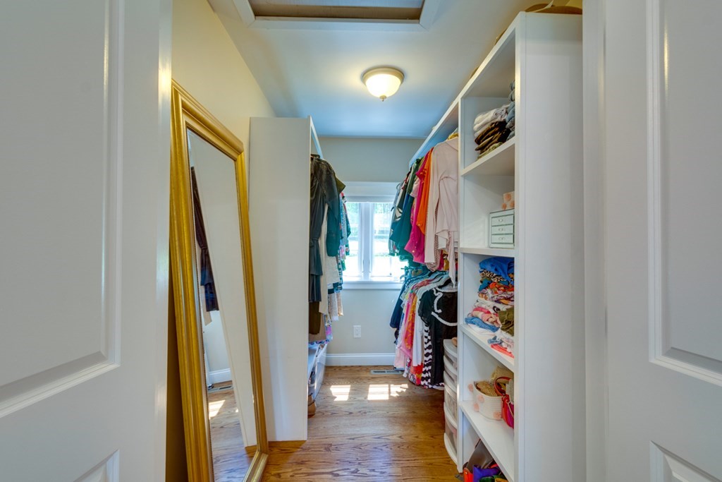 240 Summer Street Walpole, MA 02071 - Photo 20 of 34 a view of walk in closet with clothes and shoes