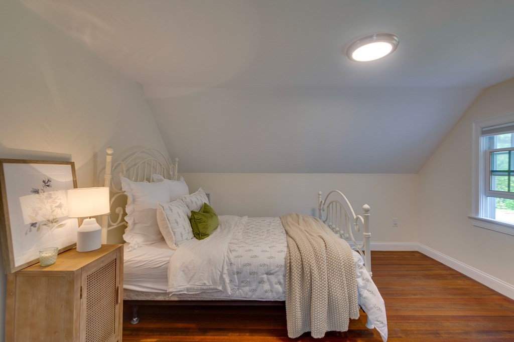 240 Summer Street Walpole, MA 02071 - Photo 23 of 34 a bedroom with a bed and wooden floor