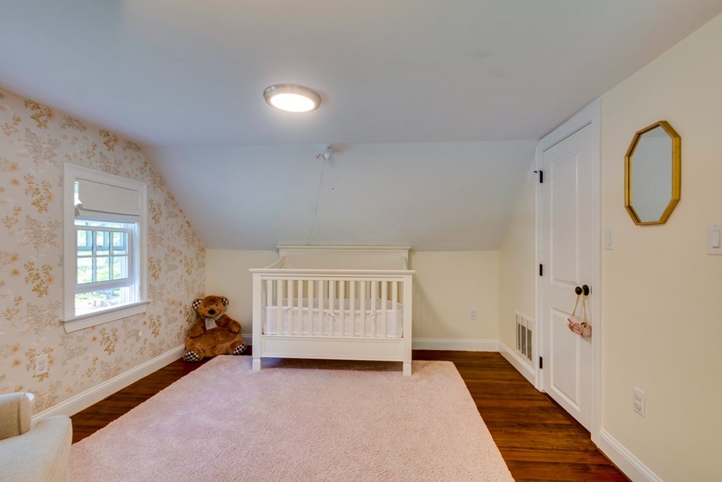 240 Summer Street Walpole, MA 02071 - Photo 26 of 34 a view of an empty room with wooden floor and a window
