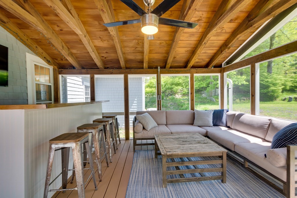 240 Summer Street Walpole, MA 02071 - Photo 28 of 34 a living room with furniture a wooden floor and a large window