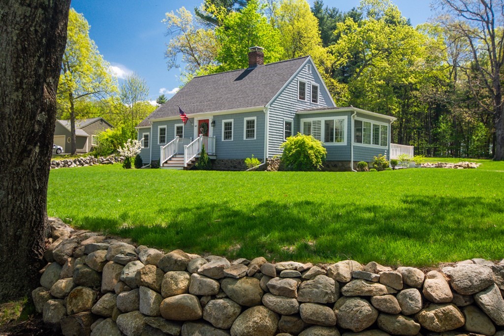 240 Summer Street Walpole, MA 02071 - Photo 3 of 34 a front view of a house with a big yard and potted plants
