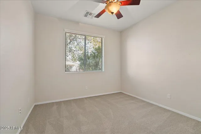 an empty room with closet area