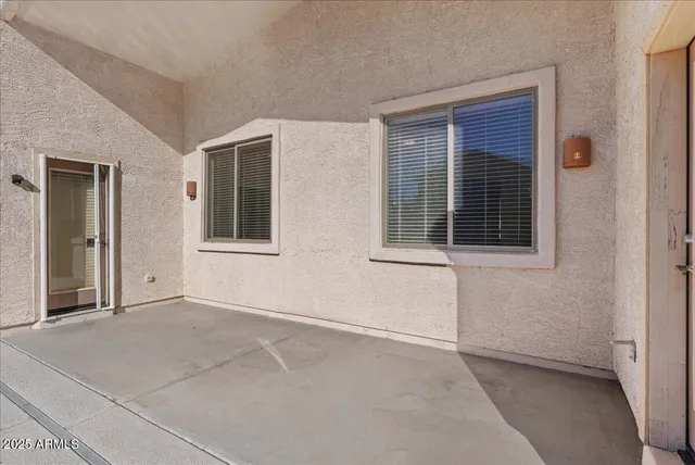 a view of a swimming pool in a backyard