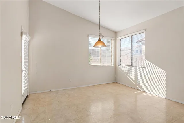 a open kitchen with cabinets and stainless steel appliances