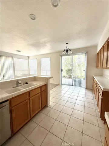 a large bathroom with a double vanity sink a mirror and a bathtub