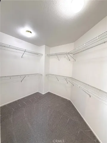 a view of a room with an empty walk in closet